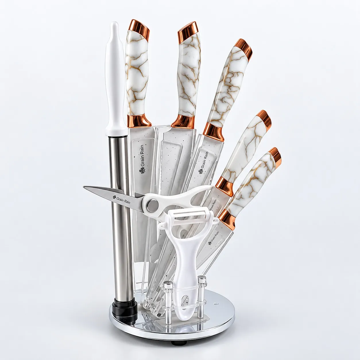 Rose gold knife set on a rotating acrylic stand