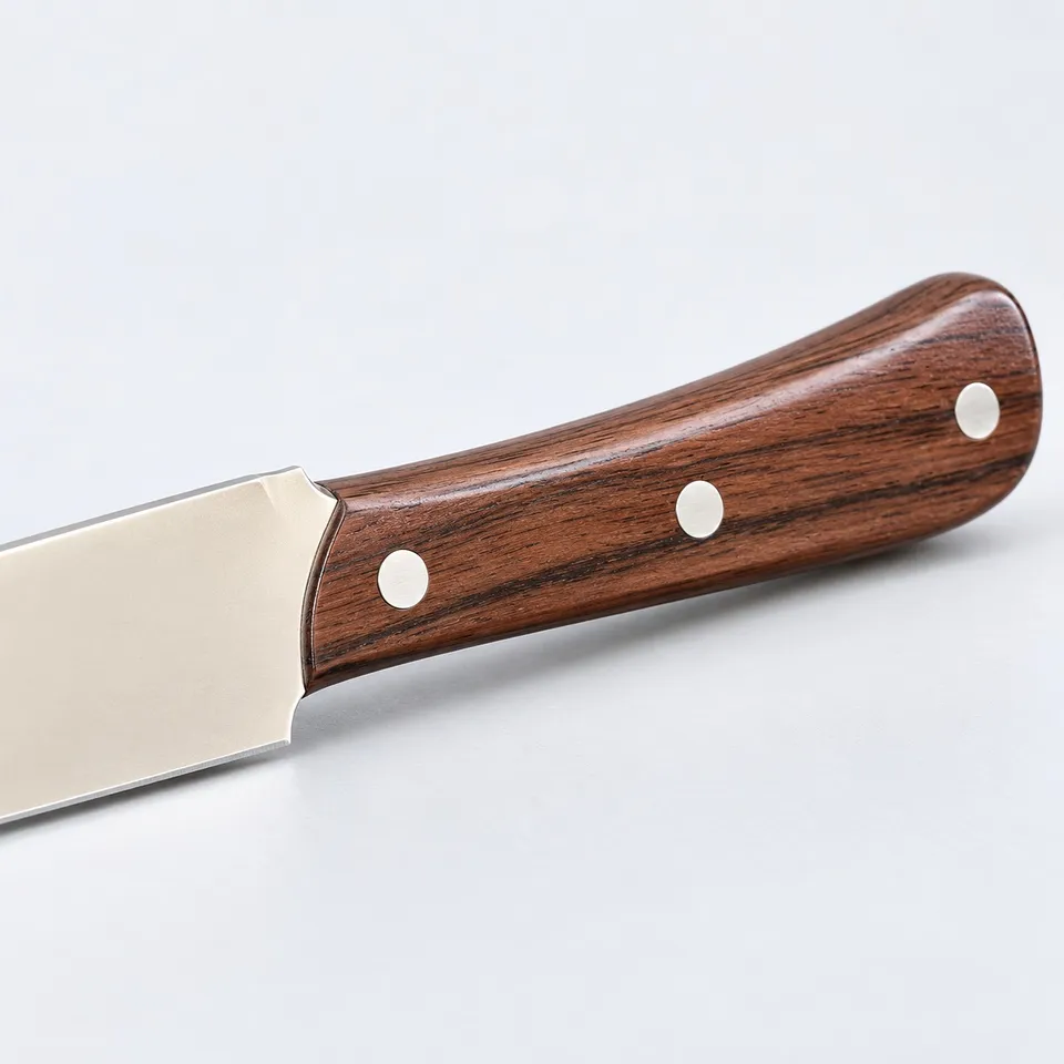 Brown wooden handle and rivets of the fruit knife