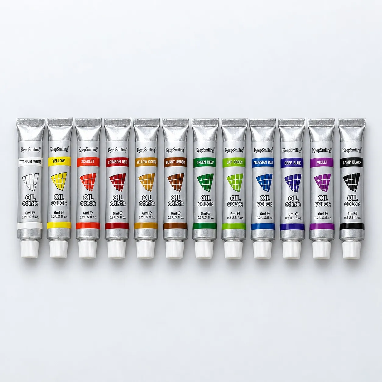 12 Keep Smiling oil paint tubes in a row