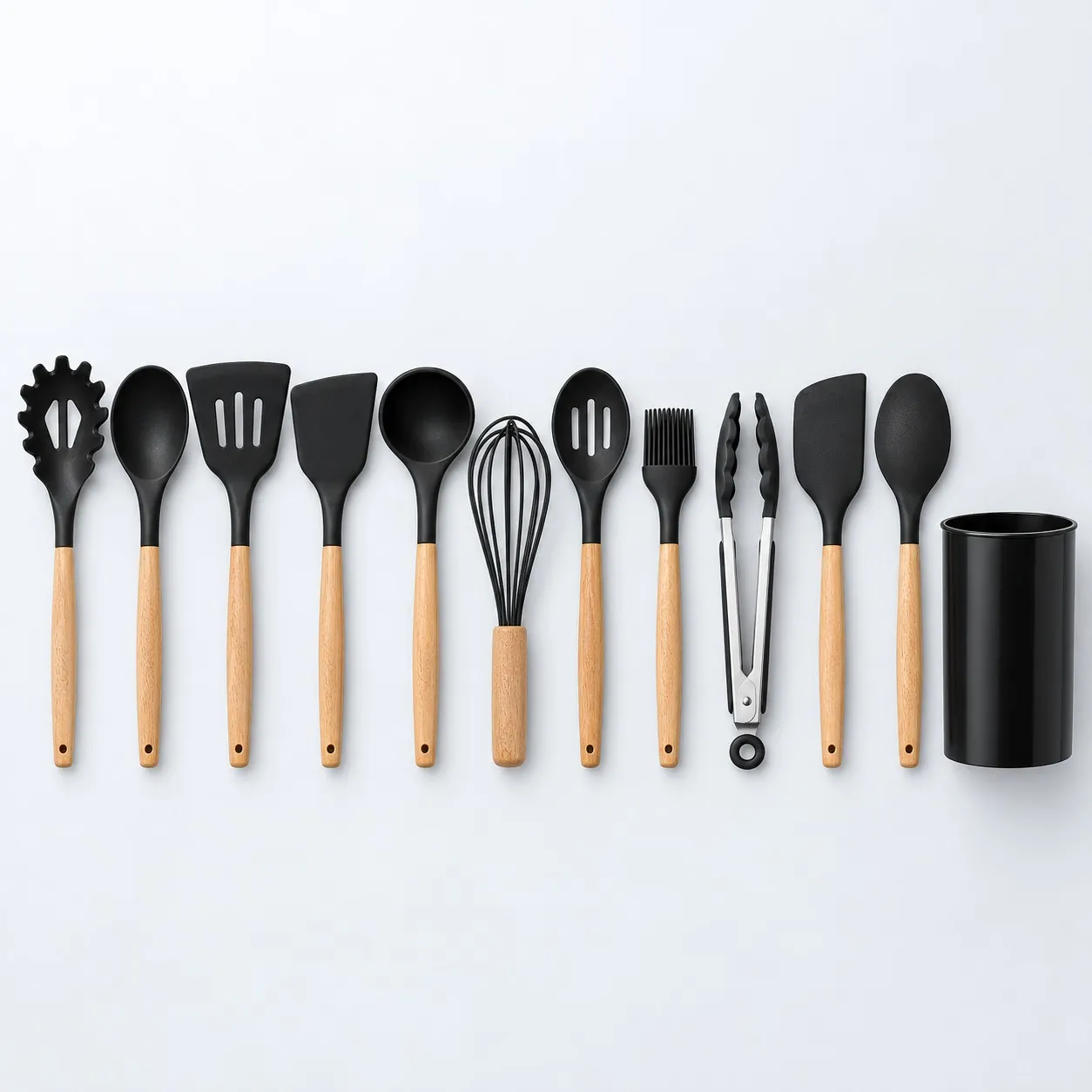 All 11 silicone cooking tools laid out next to the holder