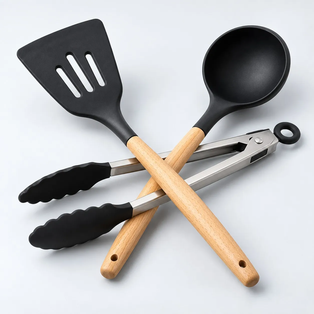 Close-up of the silicone heads, wooden handles and tongs