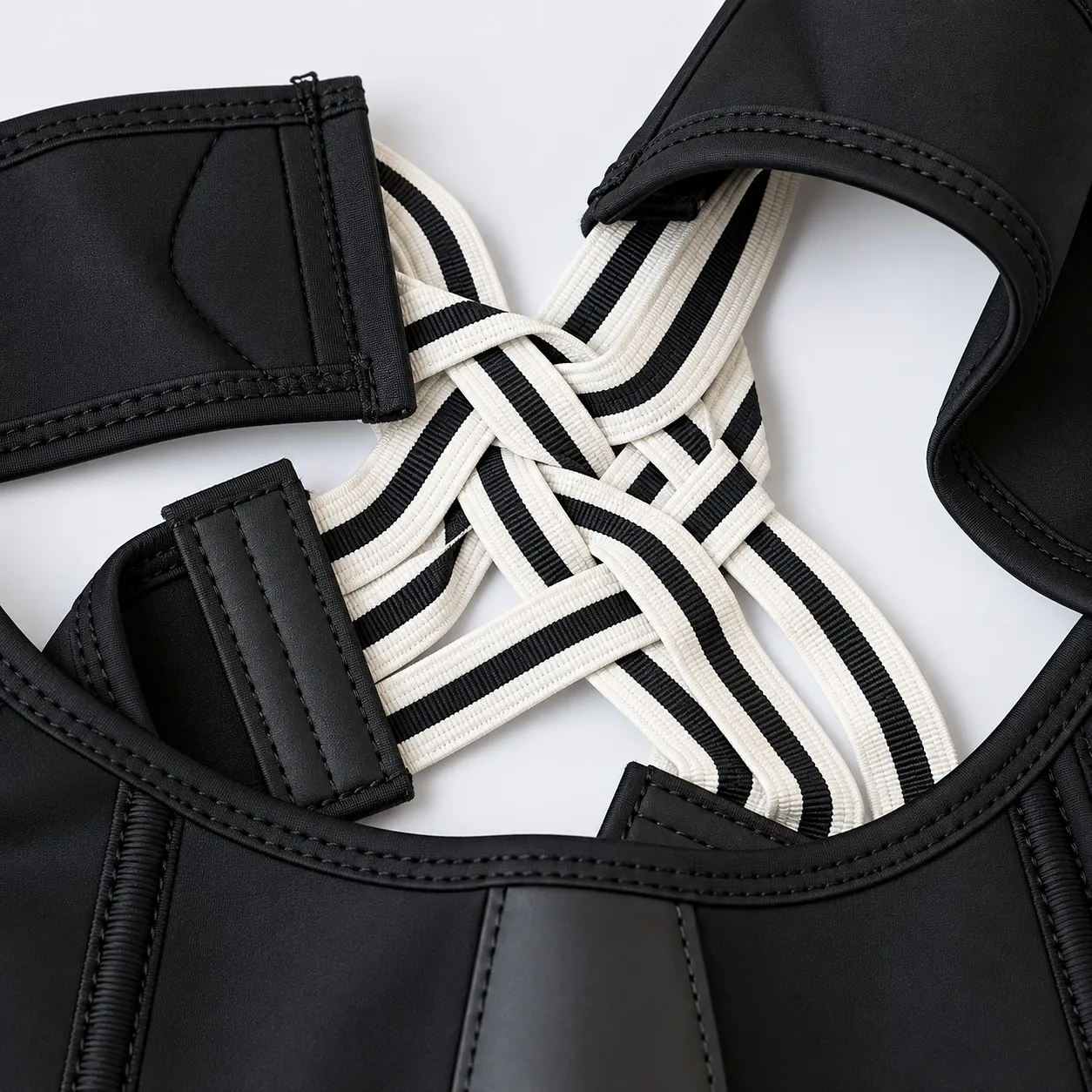 Close-up of the striped elastic X straps on the vest