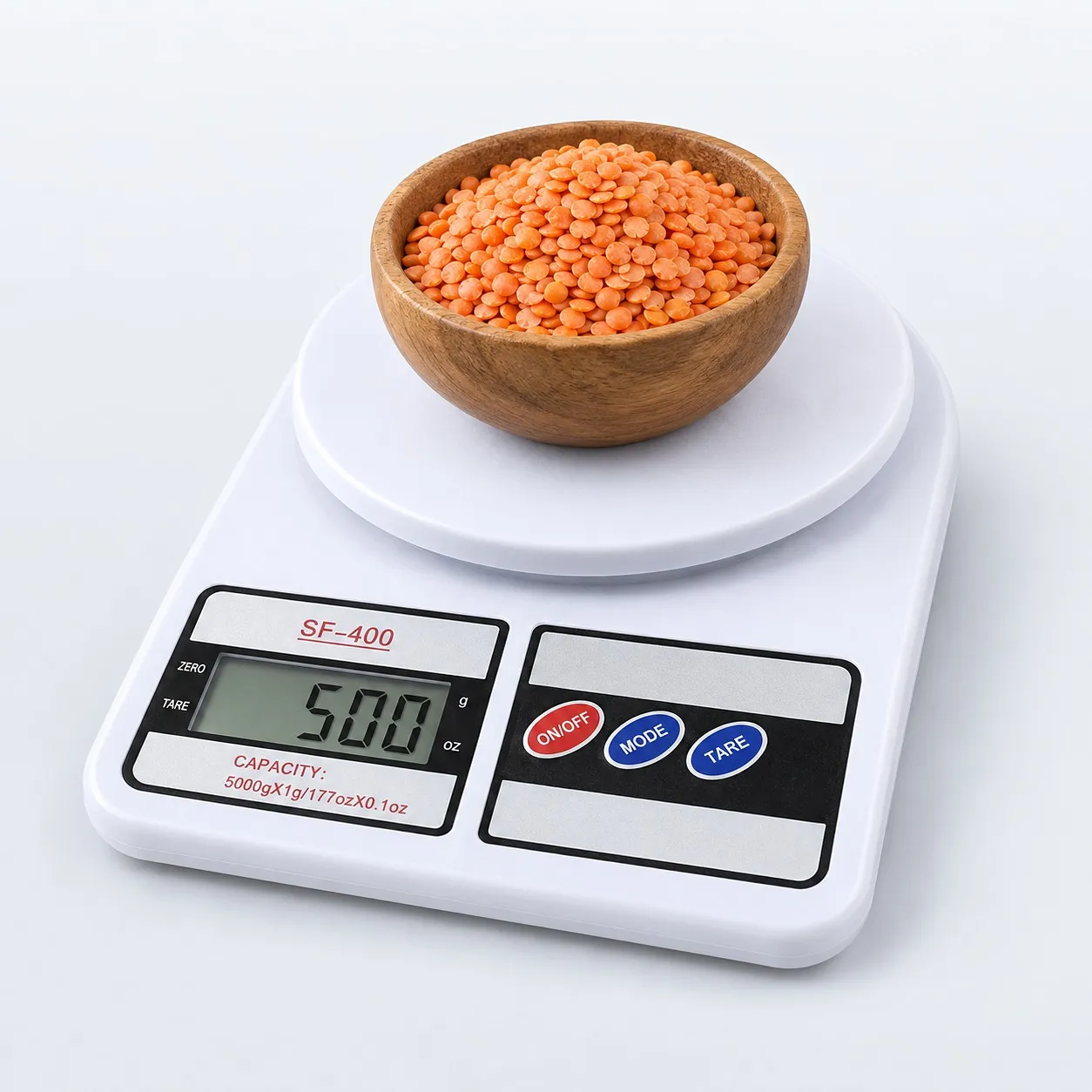 Kitchen scale weighing lentils in a bowl