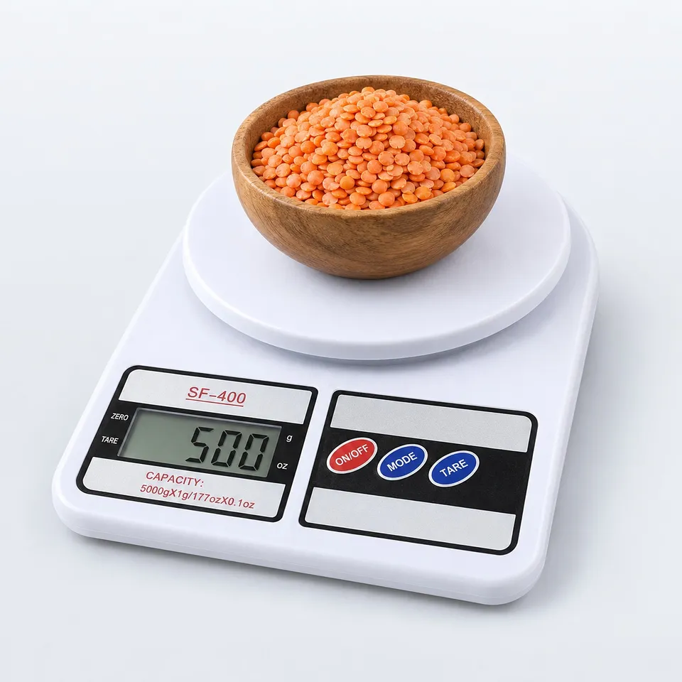 Kitchen scale weighing lentils in a bowl